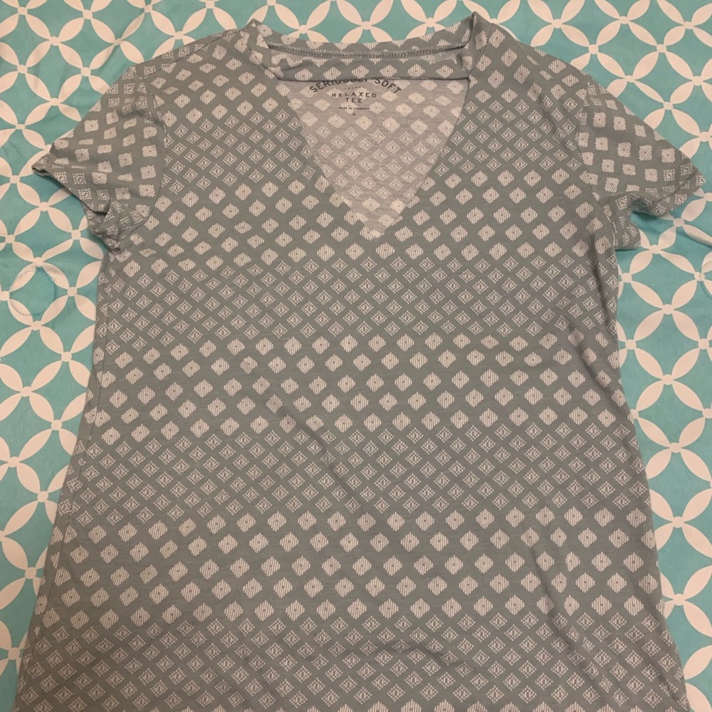 Blue and white shirt with low cut chest